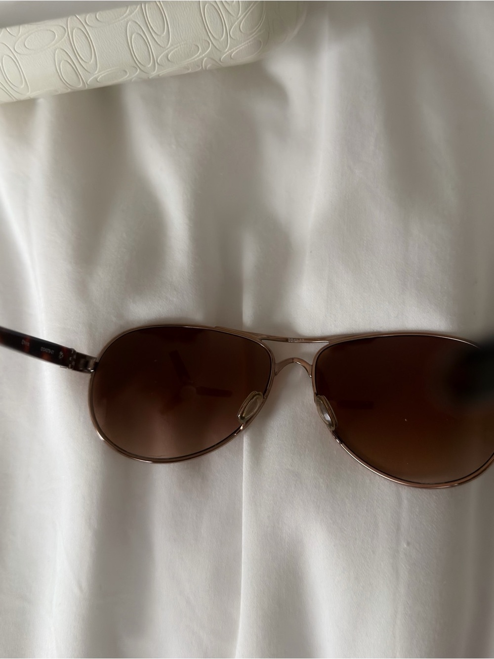 Oakley Women's Rose Gold frame, brownish lens. Aviator Sunglasses - Picture 7 of 10